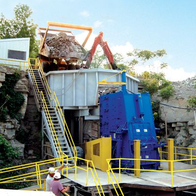 Industrial site with blue willpactor used for impact crushing - Williams Patent Crusher